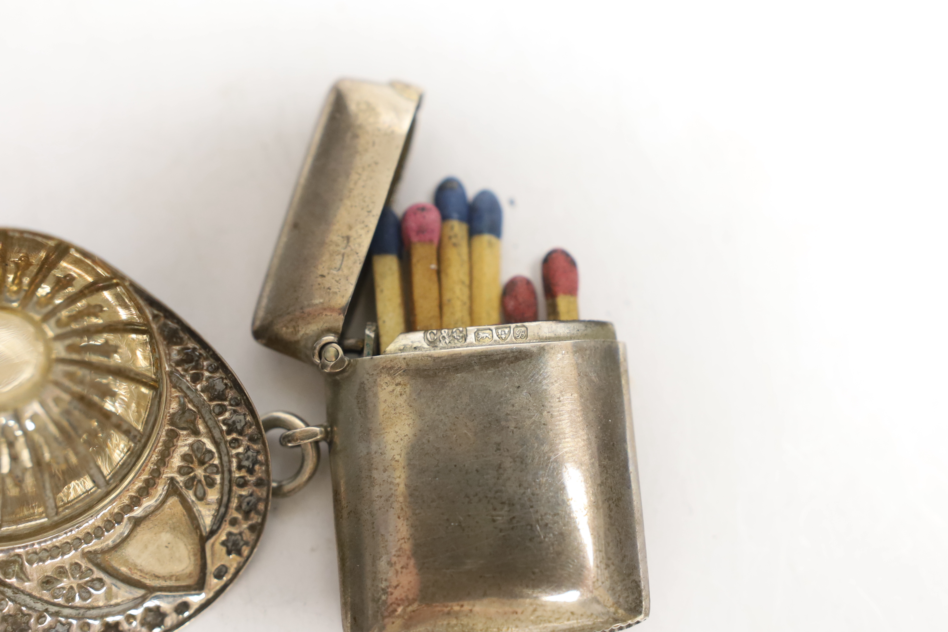 An Elizabeth II silver jockey cap caddy spoon, Francis Howard Ltd, Sheffield, 1973, 52mm and and an Edwardian silver vesta case.